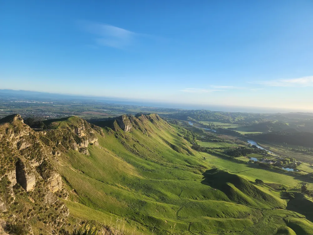 The green ridgeline of Te Mata Peak above the Tukituki Valley, seen from the summit