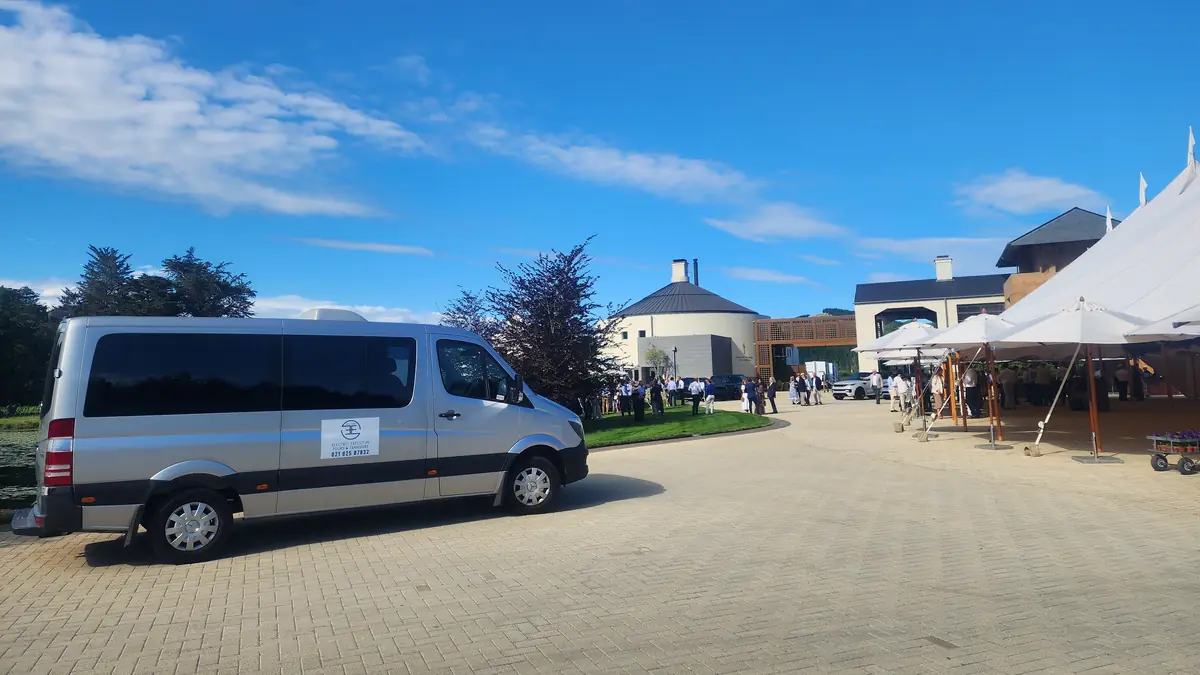 Electric Executive Mercedes-Benz Sprinter outside Craggy Range Winery on a clear Hawke's Bay day