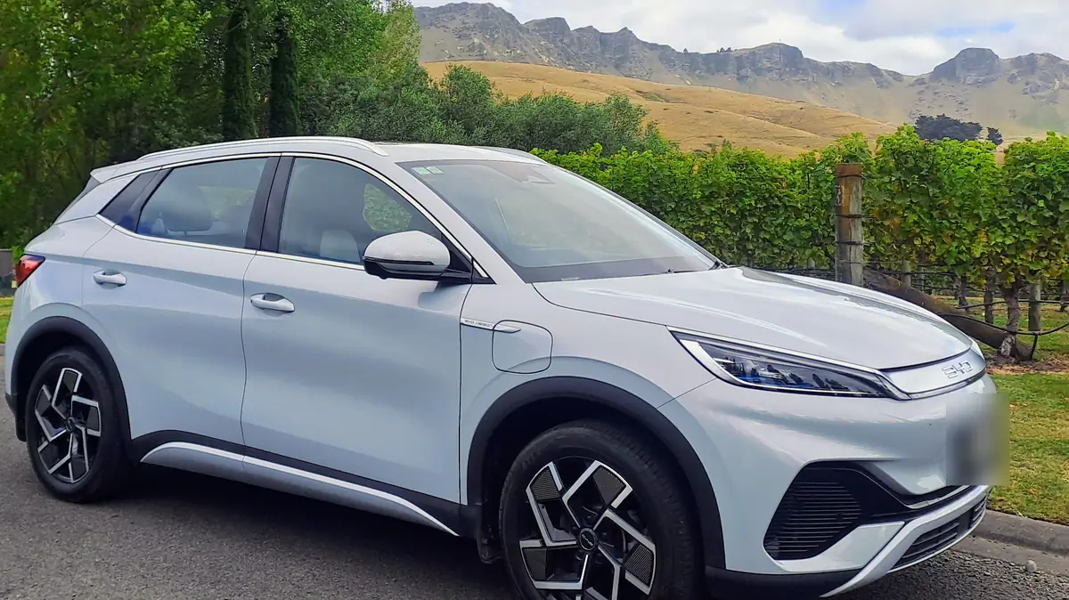 Fully electric BYD Atto 3 executive taxi beside a vineyard below Te Mata Peak, Hawke's Bay