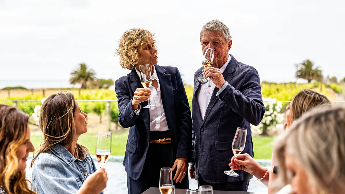 Electric Executive hosts share a tasting with guests above the vines at a Hawke's Bay winery