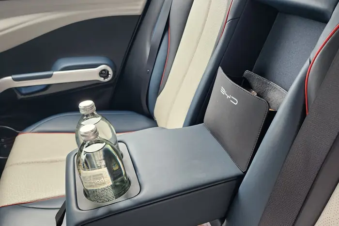 Rear seat of the fully electric BYD Atto 3 with chilled glass-bottled water