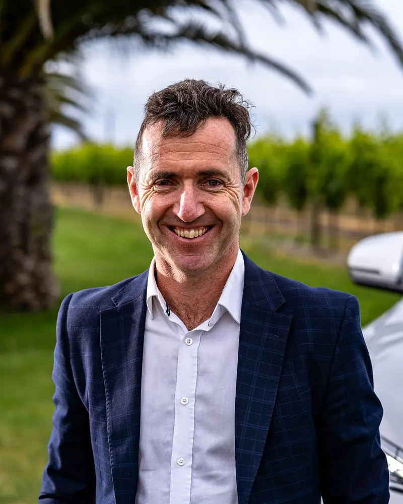 Portrait of Duncan Darroch, founder of Electric Executive, in a Hawke's Bay vineyard